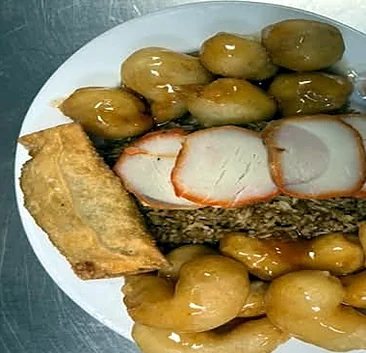 Combination plate: chicken balls, Bar-B-Q pork, egg roll and fried rice