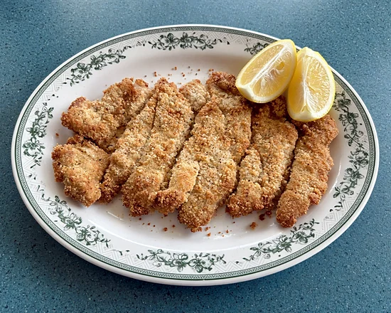 Breaded veal (dry) strips with lemon wedges
